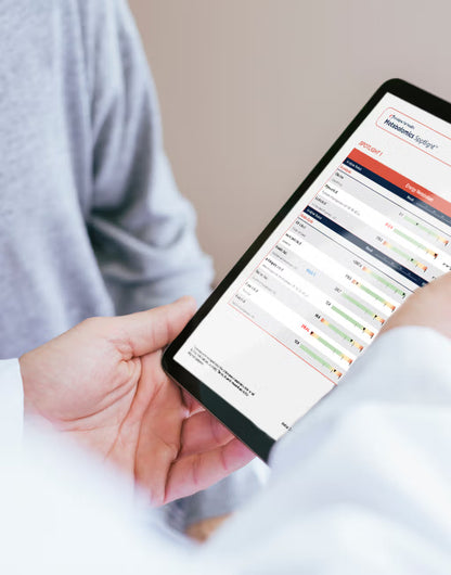 Practitioner explains GI Spotlight test results to a patient
